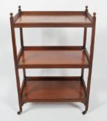 A 19th century mahogany three tier rectangular tea trolley, with reeded gallery,