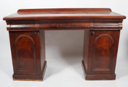 A Victorian mahogany sideboard, with three cushion shaped frieze drawers, with short gallery back,