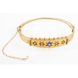 A 9ct yellow gold, 19th century hinged bangle, of openwork form,