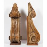 A pair of large carved wood scroll brackets, with acanthus husks and foliate medallions,