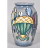 A small Moorcroft 'Balloons' pattern vase of ovoid form decorated with tubelined balloons on a blue