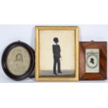 A 19th century silhouette of a schoolboy holding a riding crop,