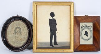 A 19th century silhouette of a schoolboy holding a riding crop,