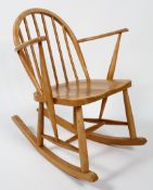 An Ercol child's rocking chair, stamped FL82,