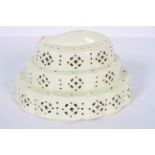 An English creamware stepped curved cheese mould, late 18th century,