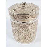 An Asian white metal canister, of round form with pull off cover,