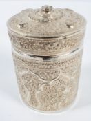 An Asian white metal canister, of round form with pull off cover,