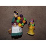 A Royal Doulton Old Balloon Seller 1315 and a Carlton fruit moulded sugar caster. (2)