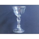 An 18thC sweetmeat glass with Silesian stem and folded foot, 6.7" high.