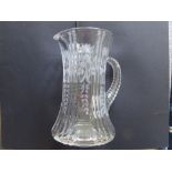 A large early 20thC cut glass water jug, 10.5" high.