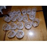 A set of six cut wine glasses on star cut bases and 12 others. (18)