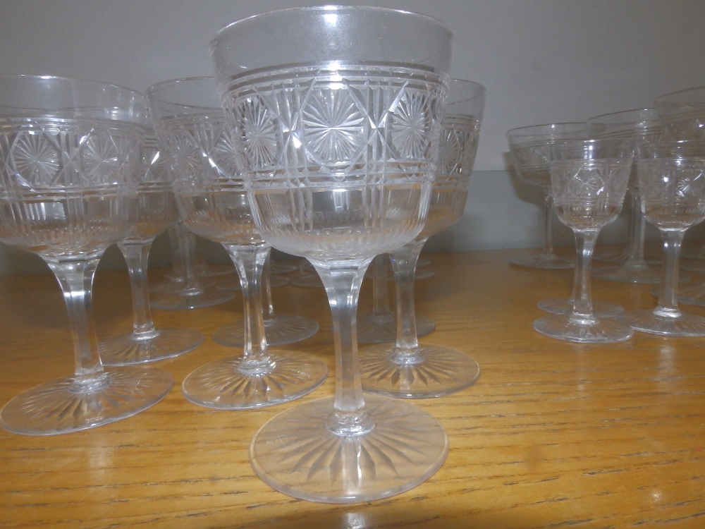 A set of cut glass wines/sherry glasses on star cut bases. - Image 3 of 3