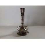 A silver plated capstan candlestick, 6.75" high.