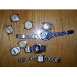 A Microma Quartz bracelet watch and eight others. (9)