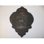 An embossed copper heraldic plaque depicting a swan, 16" high.