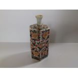 An Oriental Imari style porcelain hexagonal bottle vase, 6" high.