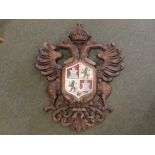 A carved wood heraldic plaque - double-headed eagle, 34" high - repaired.