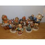 Eight Hummel figures.