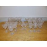 A set of cut glass wines/sherry glasses on star cut bases.
