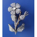 An early 19thC diamond set flower spray brooch 'en tremblant', pave set with numerous old cut stones