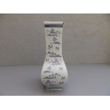 A 20thC Chinese porcelain blue & white bottle vase of rectangular section, 14" high - chipped,