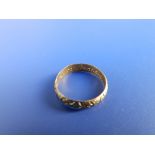 A small antique posy ring with strapwork decoration, the interior inscribed 'No felicitie to