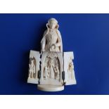 A 19thC Dieppe ivory figure of a Queen, her skirt opening on hinges to reveal a scene showing her