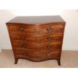 A mahogany serpentine fronted chest of four graduated drawers on splayed bracket feet.