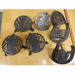 Two Bonzo cast iron trivets, a Mickey Mouse trivet, an Adelaide kangaroo stand and two 'Good Luck'