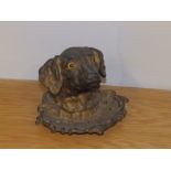 A Victorian cast iron spaniel head inkwell with glass eyes - hinge a/f, liner missing.