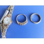 A 22ct wedding band, a 9ct dress ring and a lady's 9ct bracelet wrist watch. (3)