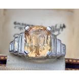 A certified natural orange/yellow Sri-Lankan sapphire & diamond ring, the rectangular cut-cornered