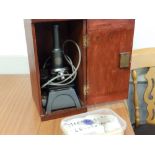An early 20thC electric microscope by C. Baker in case.