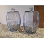 A pair of old moulded glass spirit barrels, 13.5" high.