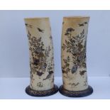 A pair of Japanese Meiji period shibayama inlaid ivory tusk vases, the sides decorated to show