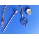 An amethyst set yellow metal pendant on necklace chain, an opal set pin and a small silver