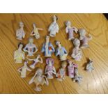 A collection of porcelain pin cushion/half dolls.