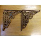 A pair of Victorian cast iron wall brackets.