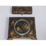 An early 20thC chinoiserie black finish mantel clock, 10.5" wide and a Mappin & Webb three piece