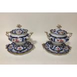 A pair of Victorian sauce tureens & covers on stands in the rococo taste, (6)