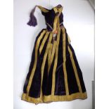 A 19thC Ottoman purple velvet cloak with bullion braid work, gilt metal clasp to hood, 34" excluding