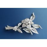 A diamond set white metal flower spray brooch, 2.2".