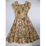 A 1950's cotton print dress, overall length 43".