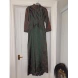 A 1930's full length evening gown in green satin with pink flowers, overall length 56".