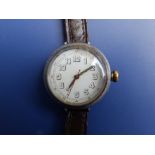 A silver WWI 'trench' wrist watch with luminous hands - white enamel dial cracked - a/f.