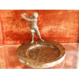 A 1930's circular serpentine marble desk stand set with a spelter model of a glofer, 10" diameter.