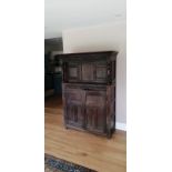 A late 17th/early 18thC oak court cupboard, the projecting cornice above a lunette carved frieze