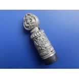 An Eastern white metal cylindrical desk seal, 2.5" high.