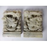 A pair of Chinese celadon soapstone dragon bookends, 7" high.