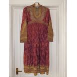 An early 20thC Ottoman ruby silk & cut velvet dress with elaborate bullion embroidered threadwork